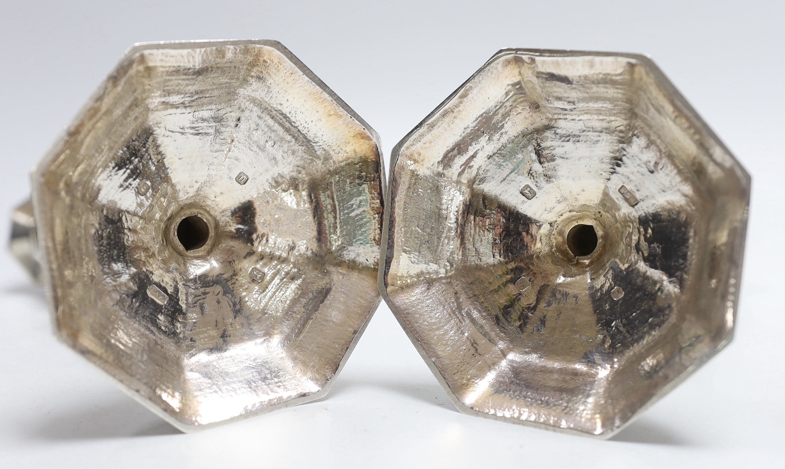 A pair of Queen Elizabeth II cast silver candlesticks, on octagonal bases, H&R, London, 1994, height 17.3cm, 30.9oz.
